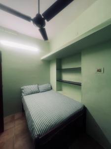 Postel nebo postele na pokoji v ubytování Smk Mukil Homestay