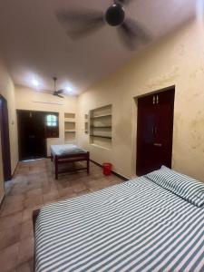 Postel nebo postele na pokoji v ubytování Smk Mukil Homestay