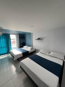 Ένα ή περισσότερα κρεβάτια σε δωμάτιο στο Hotel Oviedo Real