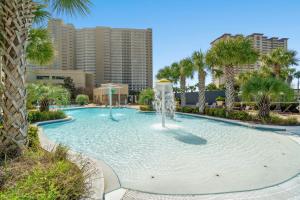 a large swimming pool with a fountain in a city at Goin Coastal Emerald Beach Unit 729 in Panama City Beach