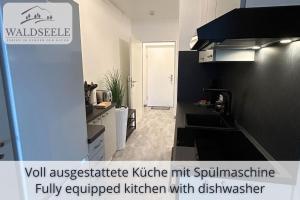 Dapur atau dapur kecil di NEU Exklusives Apartment Waldseele mit Indoor-Pool, Sauna, top Lage und Ausblick in die Natur, Hunde willkommen +43 gambar
