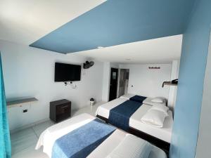 Ένα ή περισσότερα κρεβάτια σε δωμάτιο στο Hotel Oviedo Real