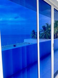 a view of the ocean from a window at GEN B Hotel in Guimbal