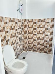 a bathroom with a toilet and a shower at GEN B Hotel in Guimbal +43 photos