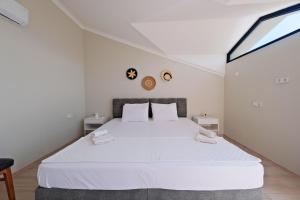 Postel nebo postele na pokoji v ubytování Villa Aromatherapy
