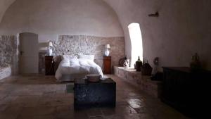 מיטה או מיטות בחדר ב-Posta Santa Croce