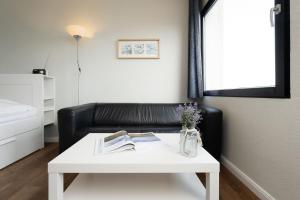 En eller flere senge i et værelse på Stranddistel 4 Bootsblick