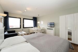 En eller flere senge i et værelse på Stranddistel 4 Bootsblick + 18 billeder