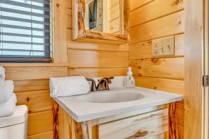 a bathroom with a sink and a toilet at Aqua Lodges at 47th Street in Marathon +23 photos