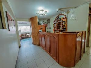 a kitchen with a wooden counter in a room at Hotel Casa Shami in Cusco