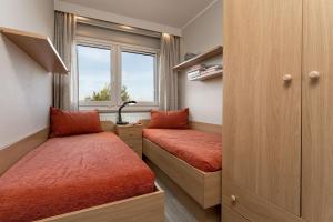 Postel nebo postele na pokoji v ubytování Berolina Nest am Meer 409