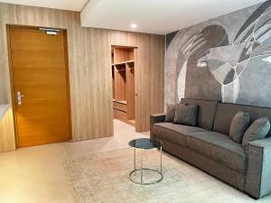 a living room with a couch and a table at Posia Retreat & Spa UNA Esperienze in San Foca