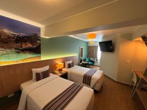 Postel nebo postele na pokoji v ubytování Hotel El Tambo 2