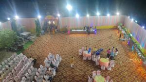 an overhead view of a stage with a crowd of people at Ramashish Palace in Chākia