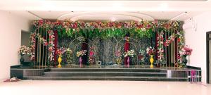 a altar with flowers and stairs in a room at Ramashish Palace in Chākia +2 photos