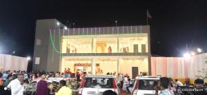 a group of people standing outside of a building at night at Ramashish Palace in Chākia