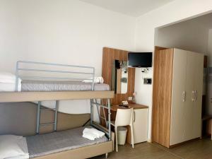 En eller flere senge i et værelse på B&b villa lambusta