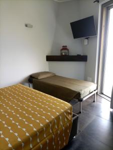 Posteľ alebo postele v izbe v ubytovaní B&B nido sul mare
