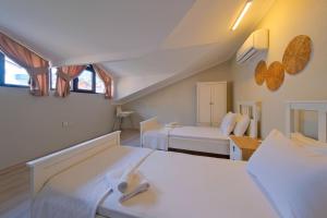 Postel nebo postele na pokoji v ubytování Villa Aromatherapy