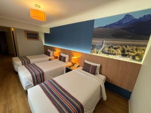 Postel nebo postele na pokoji v ubytování Hotel El Tambo 2