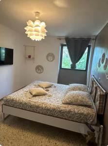 Postel nebo postele na pokoji v ubytování Gîte des Bourboul
