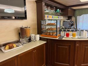 a kitchen with a counter with some pastries on it at Hotel Garni del Lago in Scanno