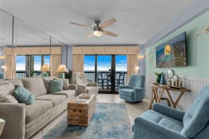 a living room with a couch and chairs at Sea Marsh II Unit 603 - Oceanfront in Myrtle Beach