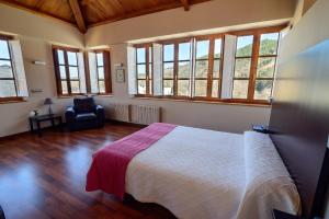 Postel nebo postele na pokoji v ubytování Hostal El Palacio