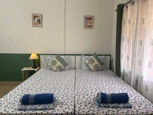 Postel nebo postele na pokoji v ubytování Mulaqat Homestay