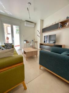 a living room with two couches and a table at Alger - Dely Ibrahim - Appartement moderne et cosy in Deli Ibrahim