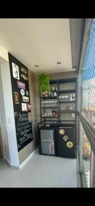 a fast food restaurant with a menu on the wall at COBERTURA Cidade Velha COP 30 in Belém +3 photos