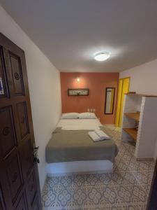 Postel nebo postele na pokoji v ubytování Biergarten Suites