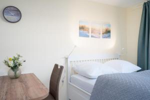 Postel nebo postele na pokoji v ubytování Haus Seeburg Ostseebrise Arosa