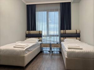 Letto o letti in una camera di Fidji Hotel