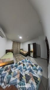a bedroom with two beds in a room at Luxury Seaview Apartment in Sharm El Sheikh