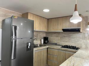 Kuchyň nebo kuchyňský kout v ubytování Acogedor y Moderno Apartamento en Barranquilla