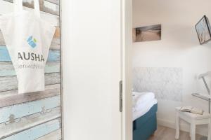 Postel nebo postele na pokoji v ubytování Villa am Meer Pier 52