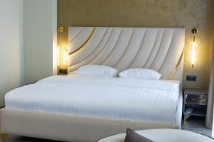 Letto o letti in una camera di Fidji Hotel
