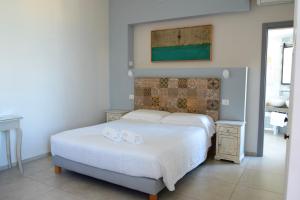 A bed or beds in a room at Dimora Marinucci