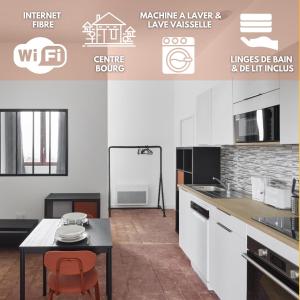 a kitchen with a table and a counter top at West Side Story - Wifi ,City center in Beaupréau