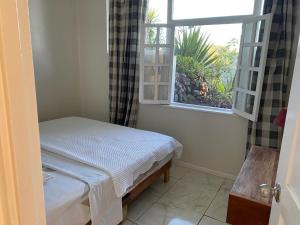 Ένα ή περισσότερα κρεβάτια σε δωμάτιο στο The Apartment at Tranquility Estate +37 φωτογραφίες