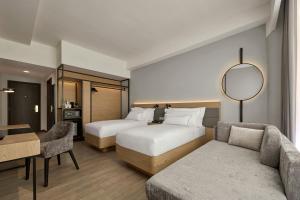 Postel nebo postele na pokoji v ubytování AC Hotel by Marriott Ipoh
