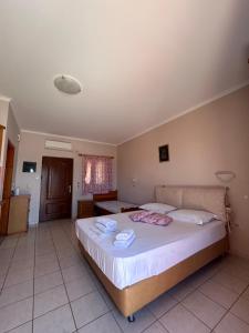 Posteľ alebo postele v izbe v ubytovaní Dimitra Rooms