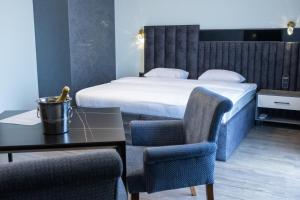 Letto o letti in una camera di Fidji Hotel