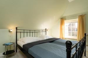 Postel nebo postele na pokoji v ubytování Villa FarbenFroh