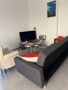 Μια τηλεόραση ή/και κέντρο ψυχαγωγίας στο Résidence OKIKE