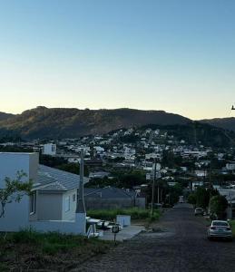 a view of a city from a hill at Casa com visto para o Cristo e cidade in Encantado