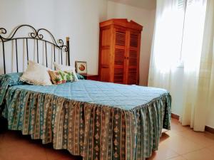 En eller flere senge i et værelse på Burriana Playa