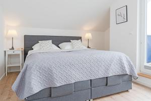 Postel nebo postele na pokoji v ubytování Seepark Süssau Seeadler 4