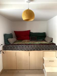 a large bed on top of cabinets in a room at Cozy mountain retreat in Sumvitg +21 photos